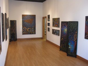 Veteran/Artist John Miller exhibits his paintings in New Genesis Art Gallery