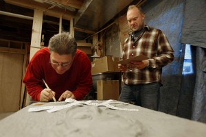 Troy Muller, right, and Billy Marples work on a bronze relief on Oct. 31, 2008 --OWH